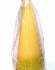 Lumanare conica, parfumata, in nuante de galben-verde